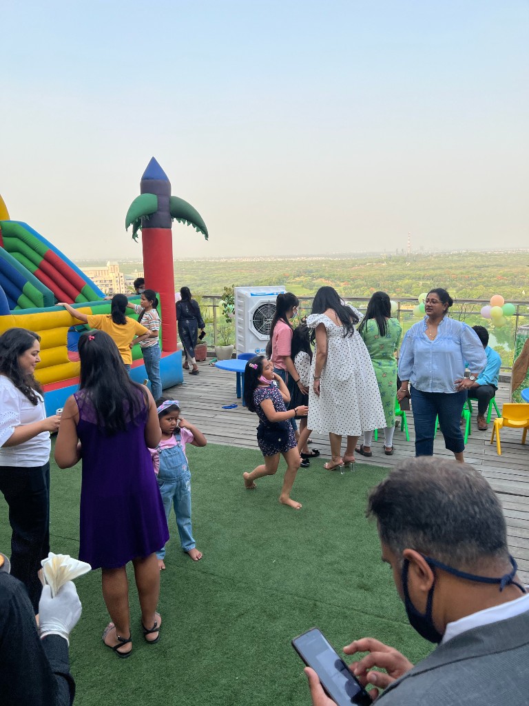 Employee family gathering with children at a Su-Kam-style celebration