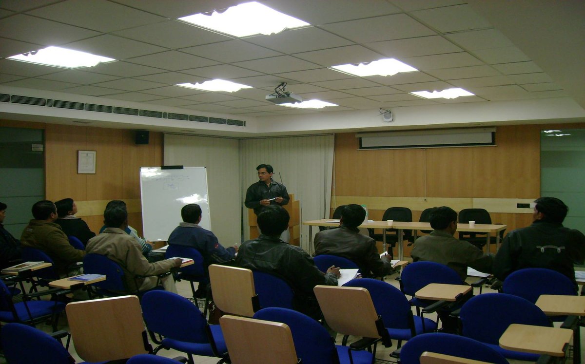 In-house corporate presentation training room with instructor and team