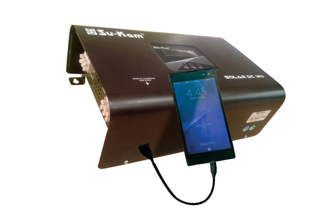 Solar DC 120 charging a smartphone via USB port