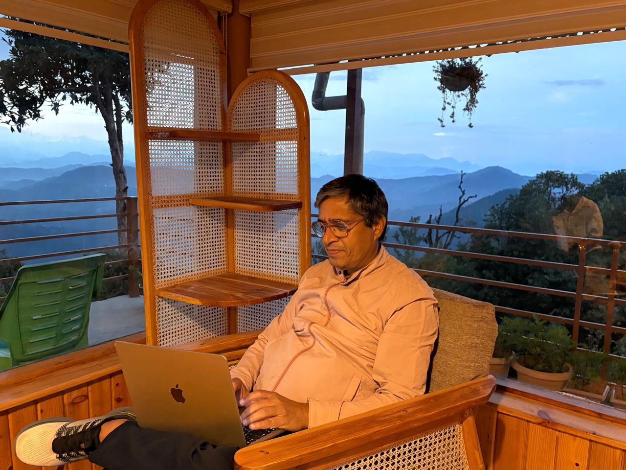 Kunwer Sachdev analyzing business compliance data on his laptop