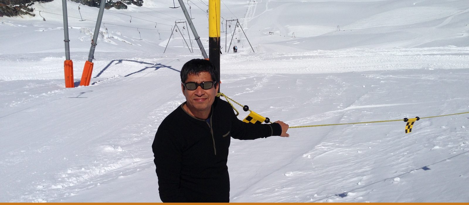 Kunwer Sachdev on a snow-covered mountain pass — the view from above the noise